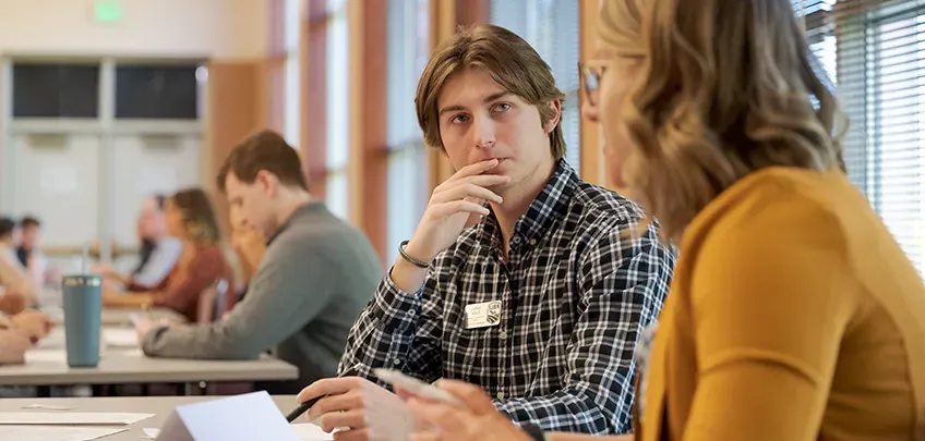 A student listens during an event featuring business leaders